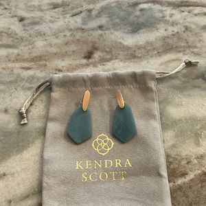 Kendra Scott earrings with rose gold finish and aqua stone